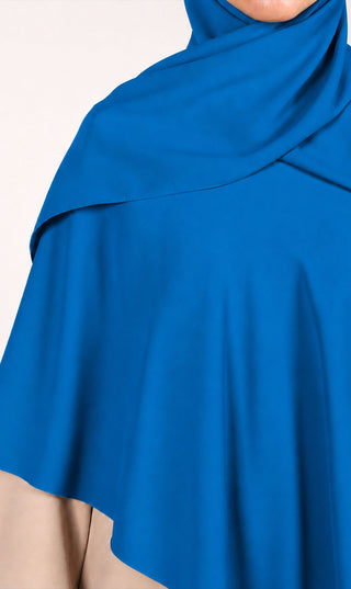 Instant khimar hoofddoek in zeeblauwe stof met sluieroverlay en asymmetrische zoom