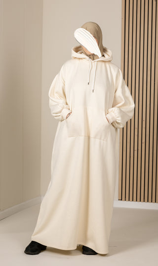 Achteraanzicht lange beige hoodie met capuchon, koordjes en wijde zoom, lange mouwen